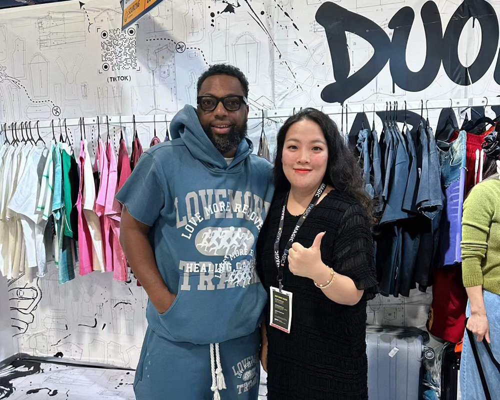 Designer beggar-style patchwork hoodie sample at DOLUXE booth
