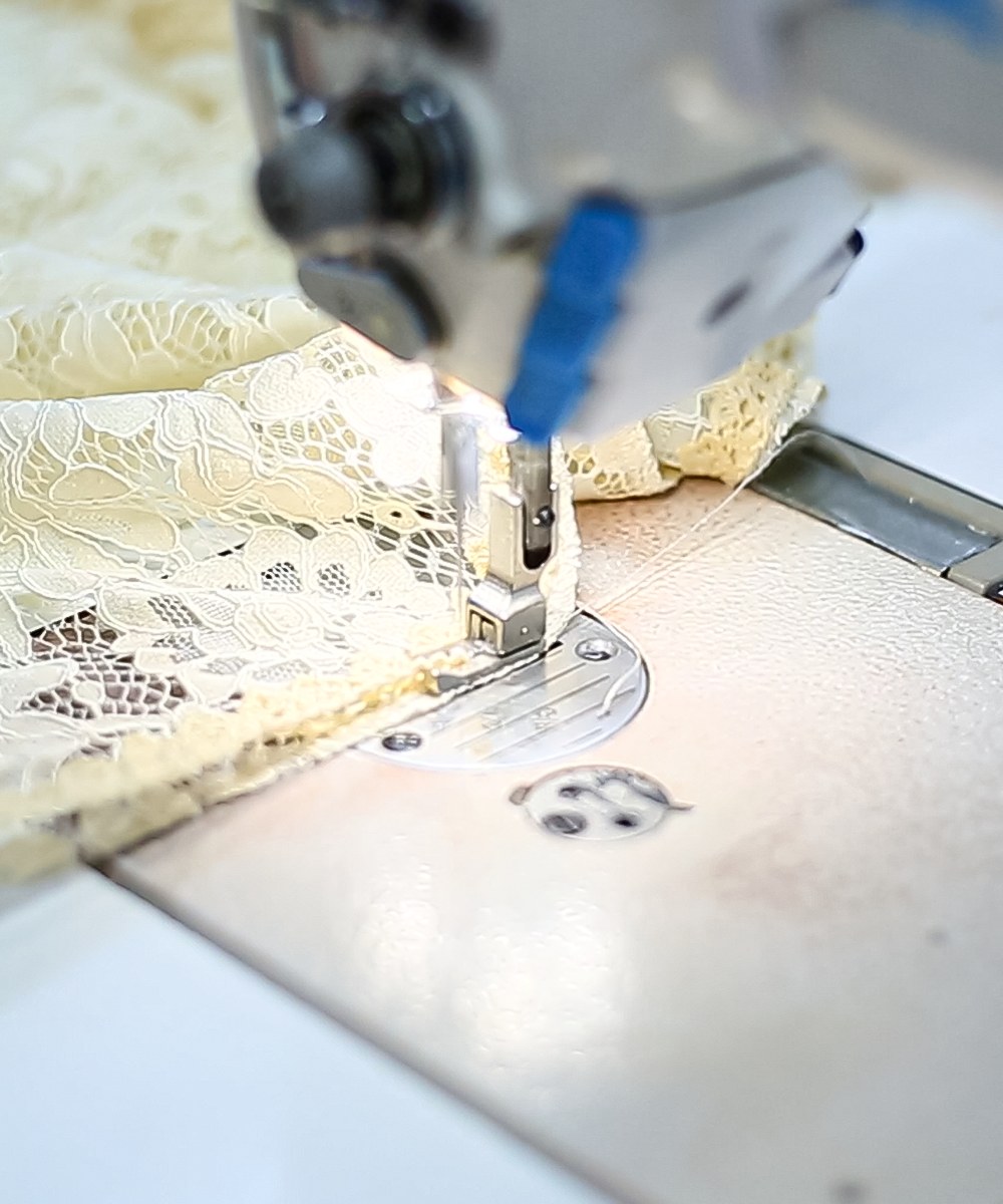 Sewing machine stitching fabric